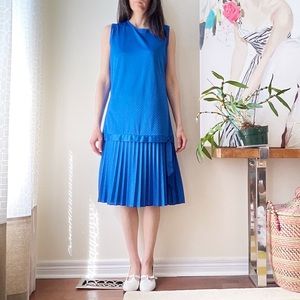 Blue midi dress with lower pleated skirt and tonal diamond design